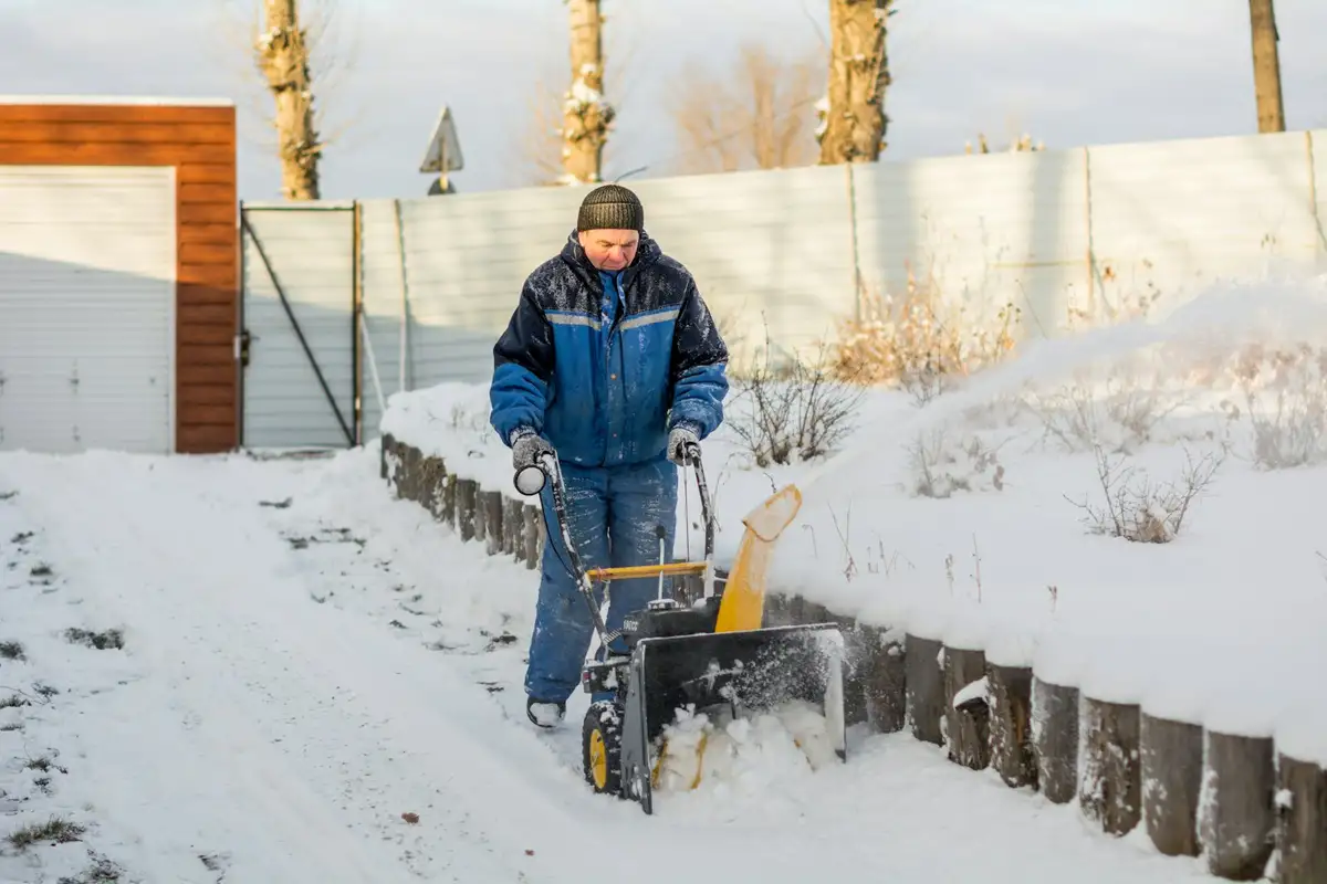 Walkway being cleared with a snow blower